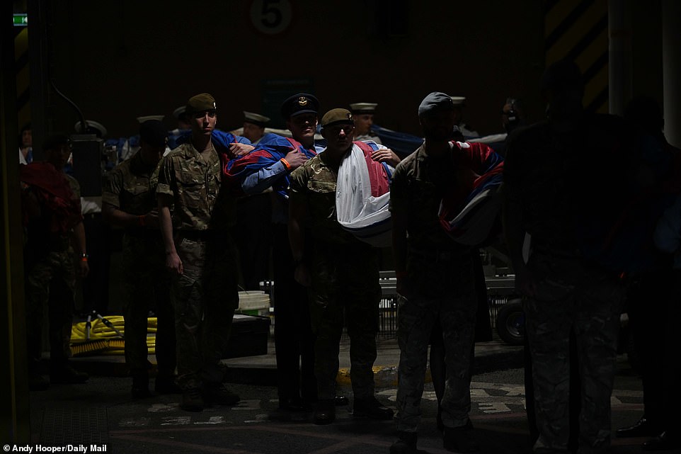 Before the match, soldiers waited to bring out the flags, for the display on the pitch for the national anthems of both sides