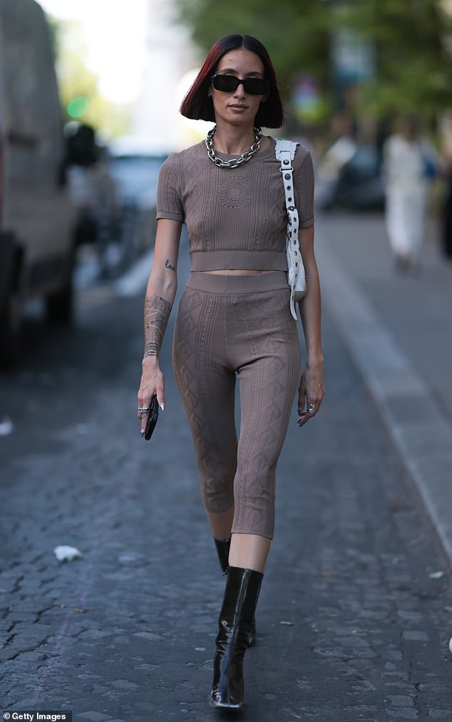 A few days later she rocked a matching knit set that showed off her petite frame and added inches to stature with high heel black boots.