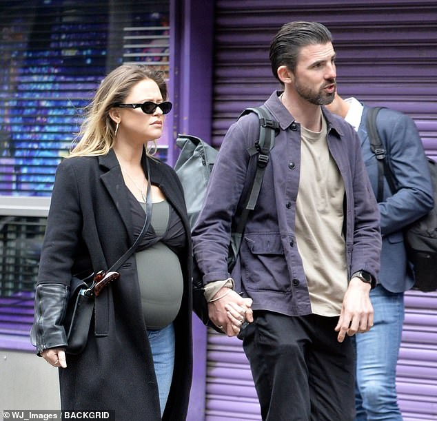 Meanwhile Alistair, whose romance with Emily emerged back in September, opted for a shirt and chinos while slicking his hair back from his handsome face