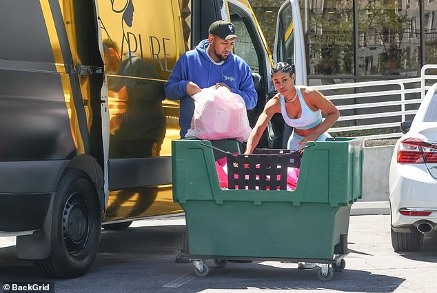 The couple was in the midst of unloading orders of lip gloss from her Lashed Cosmetics to ship from the post office