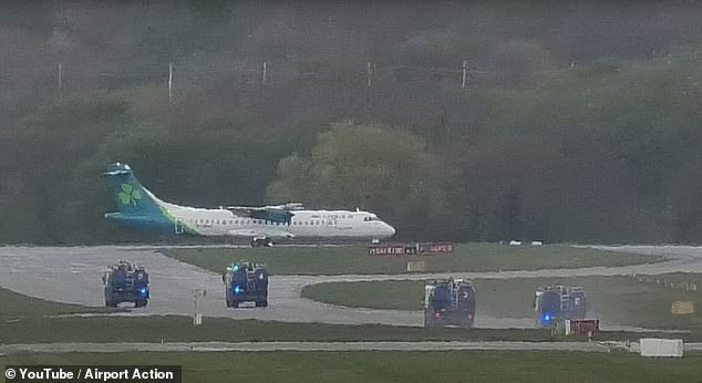 Picture shows the plane on the tarmac with emergency response vehicles