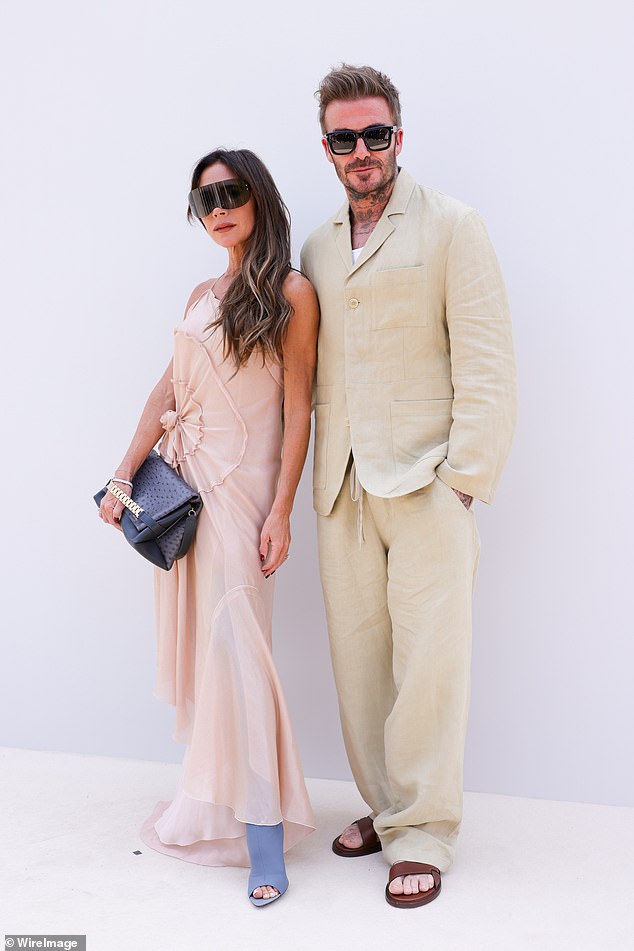 2023: She proved bigger is better when it comes to sunglasses as she joined husband David at the Jacquemus fashion show at Chateau de Versailles