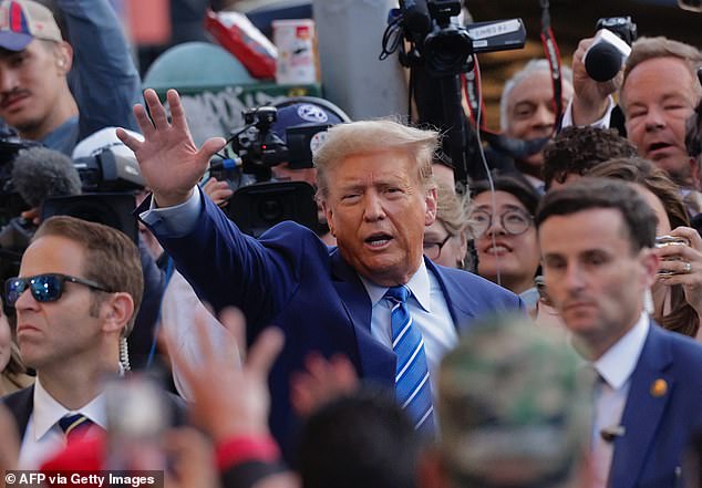 Trump received a raucous reception as he arrived at the bodega on Tuesday, as a crowd chanted 'four more years' at the former president