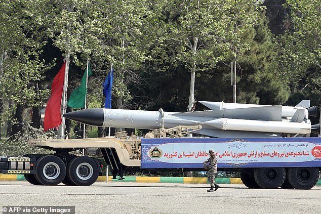 An Iranian military truck carries missiles during a military parade as part of a ceremony marking the country's annual army day in the capital Tehran on April 17, 2024