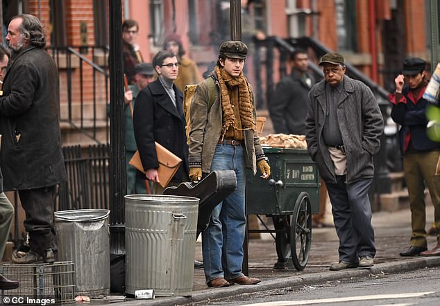 The actor also sported a pair of suede shoes and large backpack