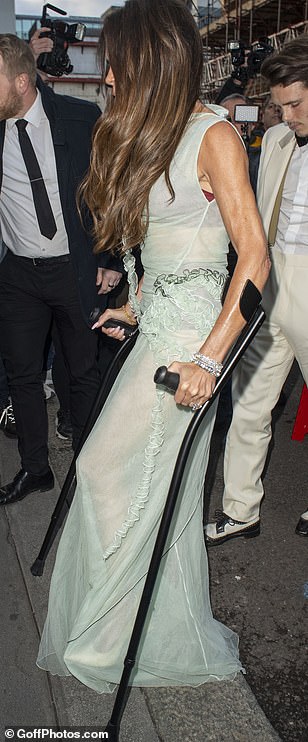 Birthday Girl Victoria's elegant sleeveless dress featured ruffles at the waist and decorative floral detail to the side