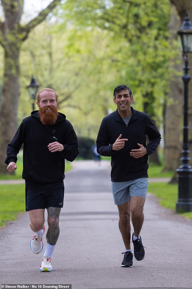 There were cheers of approval from passers-by as Mr Cook and Mr Sunak went by