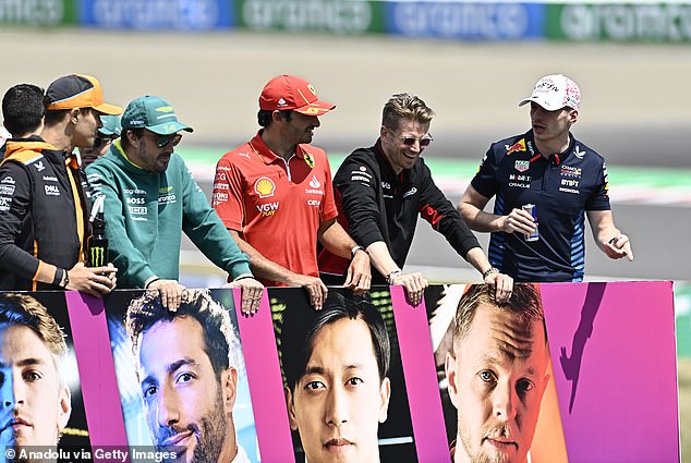 Haas driver Nico Hulkenberg (second right) will leave the team for Sauber at the end of the season