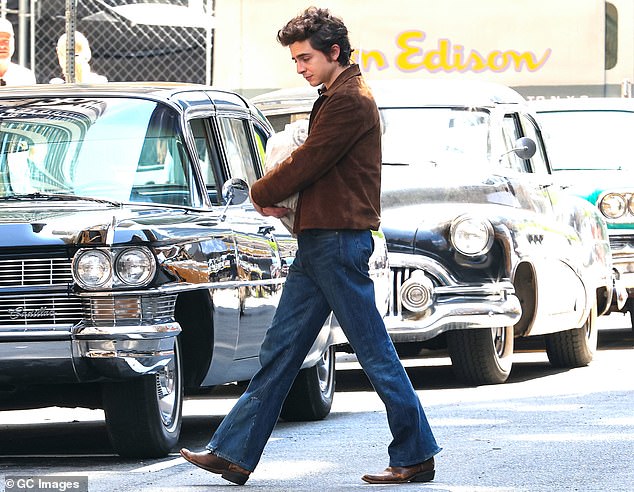 The actor appeared to carry a bag full of fan mail as he walked out of a building with a Columbia Records sign