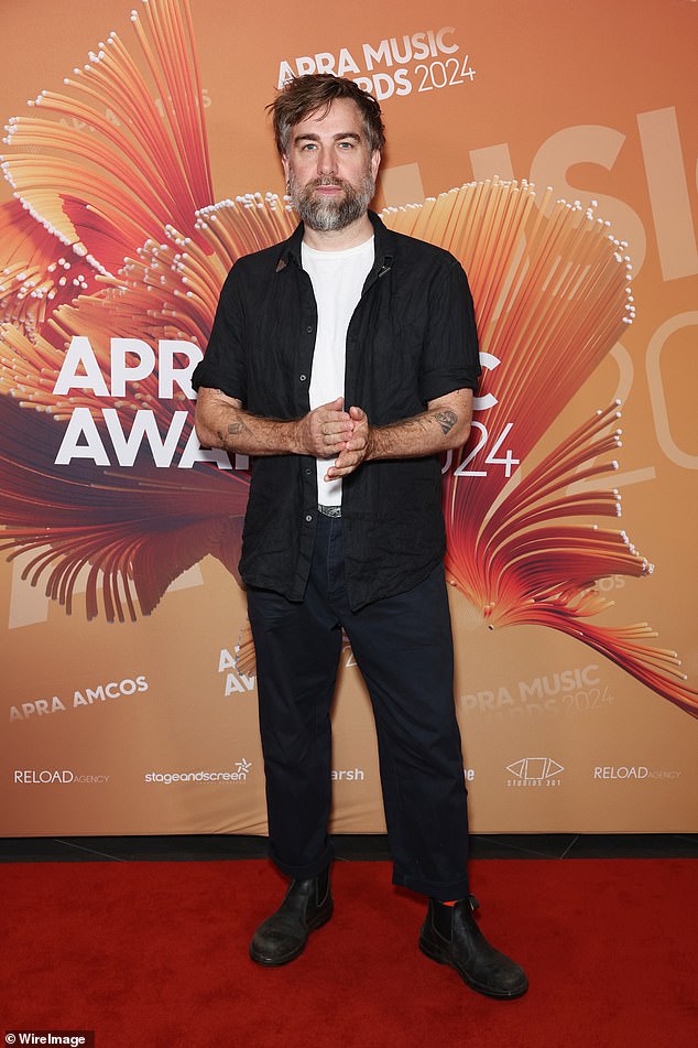 Singer-songwriter Josh Pyke arrived in a black buttoned shirt over a white tee, with black pants and boots