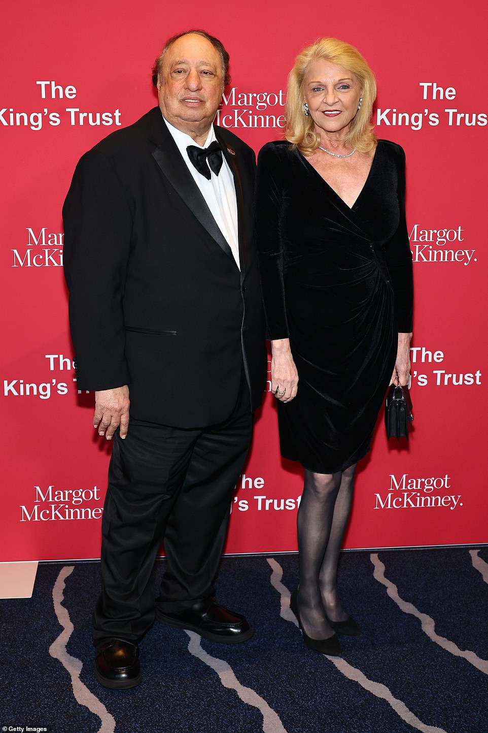 John Catsimatidis and Margo Catsimatidis matched in stylish black outfits