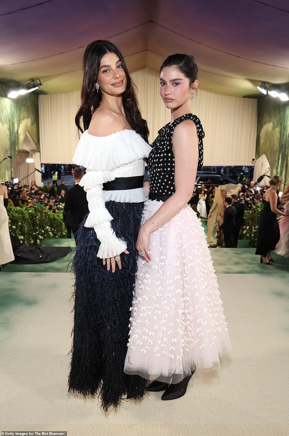 Camila Morrone (left) and Gracie Abrams (right) coordinated in their black and white ensembles