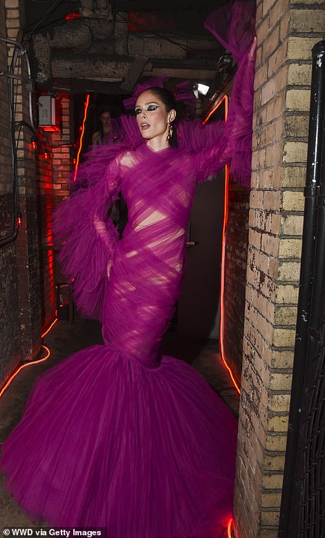 Coco Rocha turned heads in a magenta pink chiffon dress which had a mermaid tail hemline