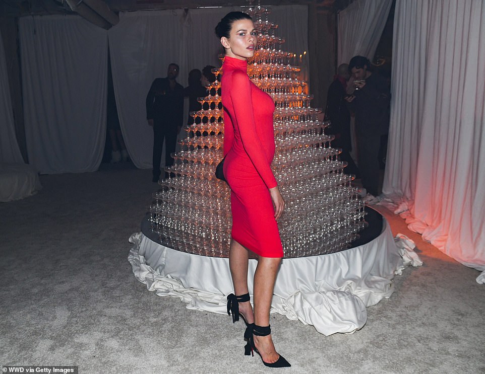 Georgia Fowler showed off her figure in a red midi-dress and black heels