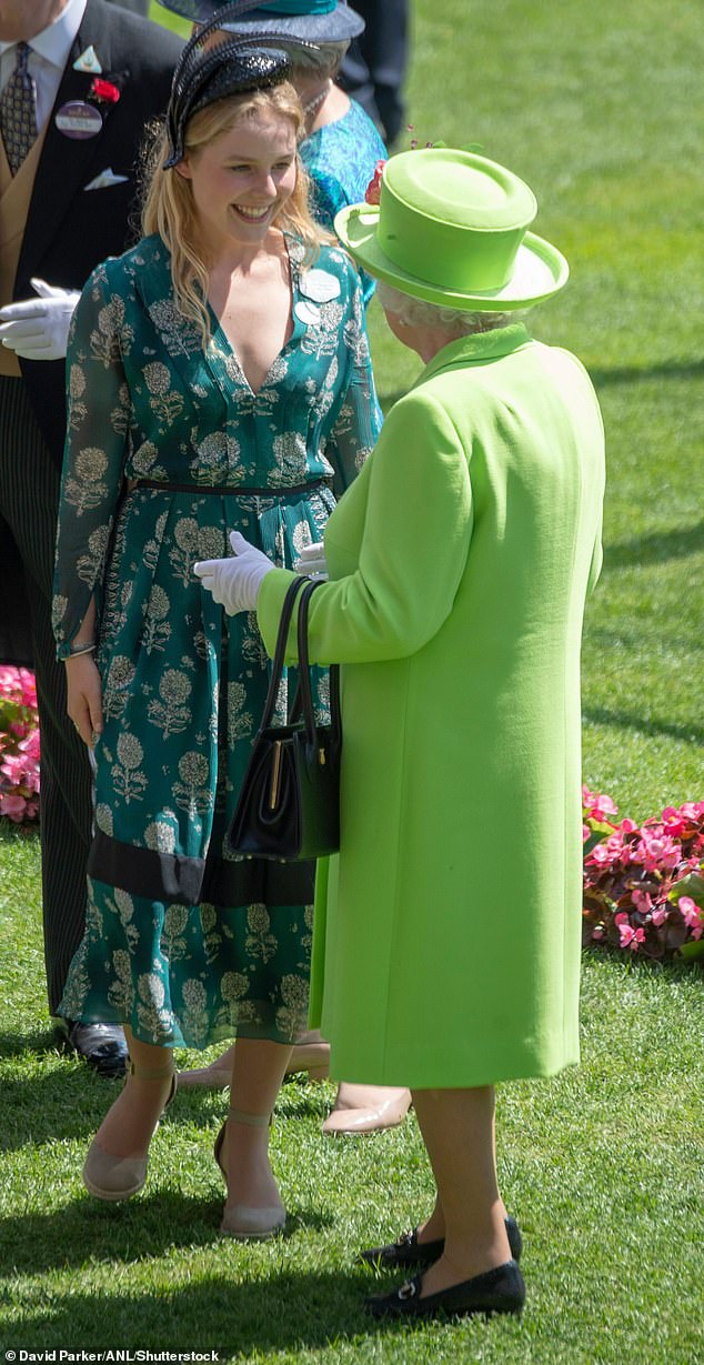 She wore one of her mother's headpieces, giving the floral frock a stylish edge