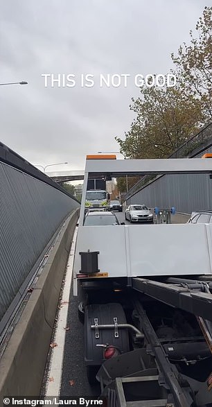 In a following clip, she shared video of traffic backed up behind the tow truck with a caption that read: 'this is not good'