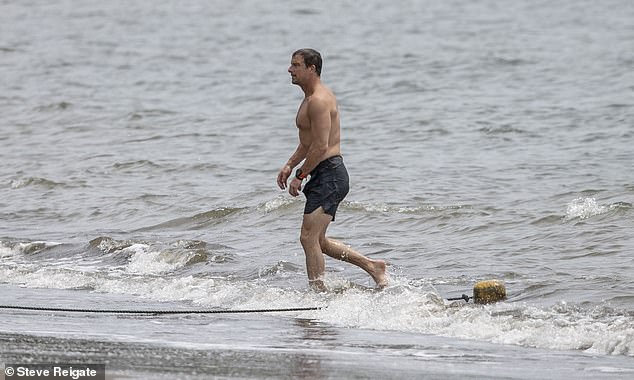 Bear, who donned dark grey swim shorts, visited the beach front in the Guanacaste province after a day prepping for the television show