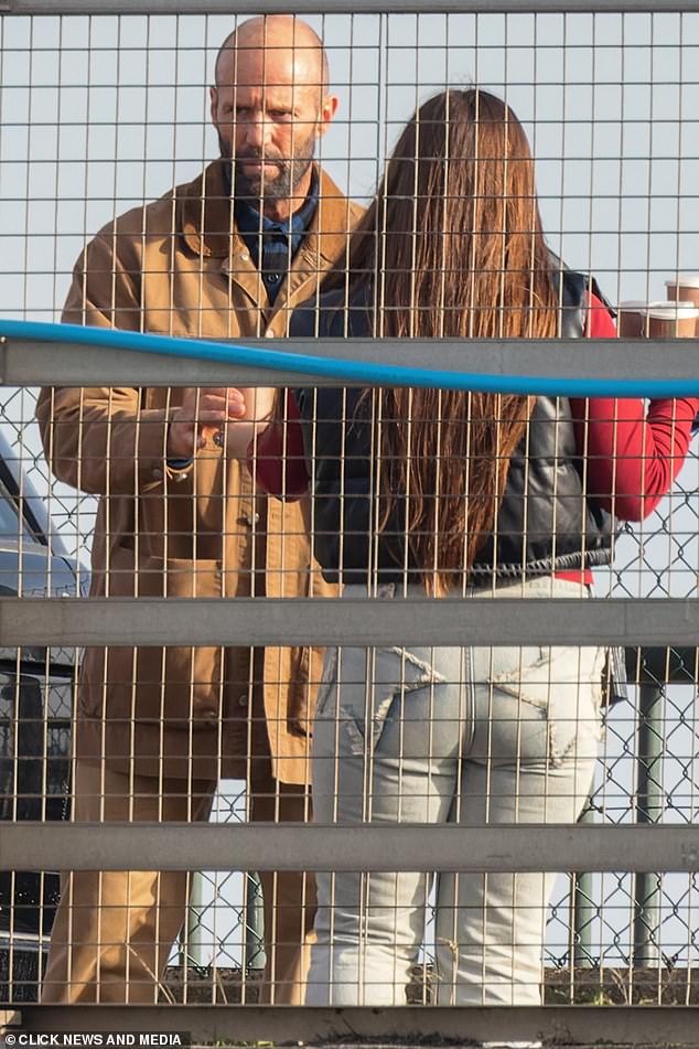 Pictured: Jason Statham wore a brown jacket and trouser co-ord as he shut down a bridge in Kent to shoot dramatic a chase sequence for his new film The Beekeeper in October 2022