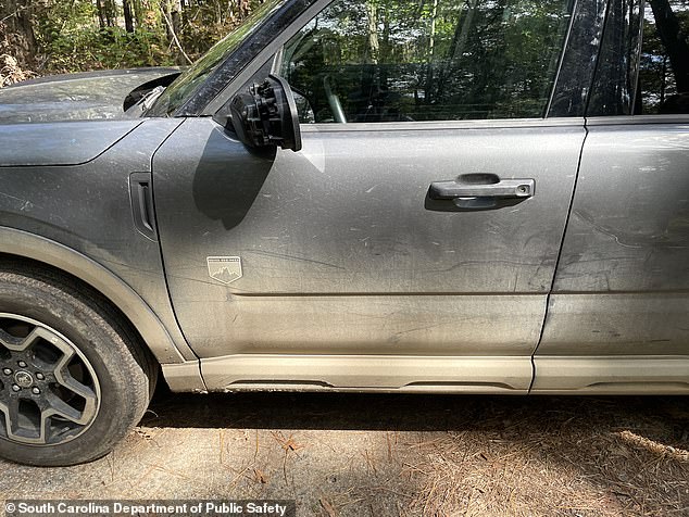 Police images show several large dents caused by her collision with officer Ward's stop sign