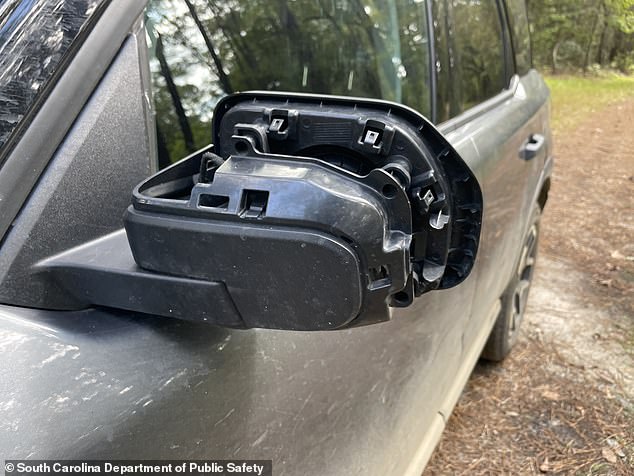 The vehicle's sideview mirrors were shorn of their casings, the photos reveal