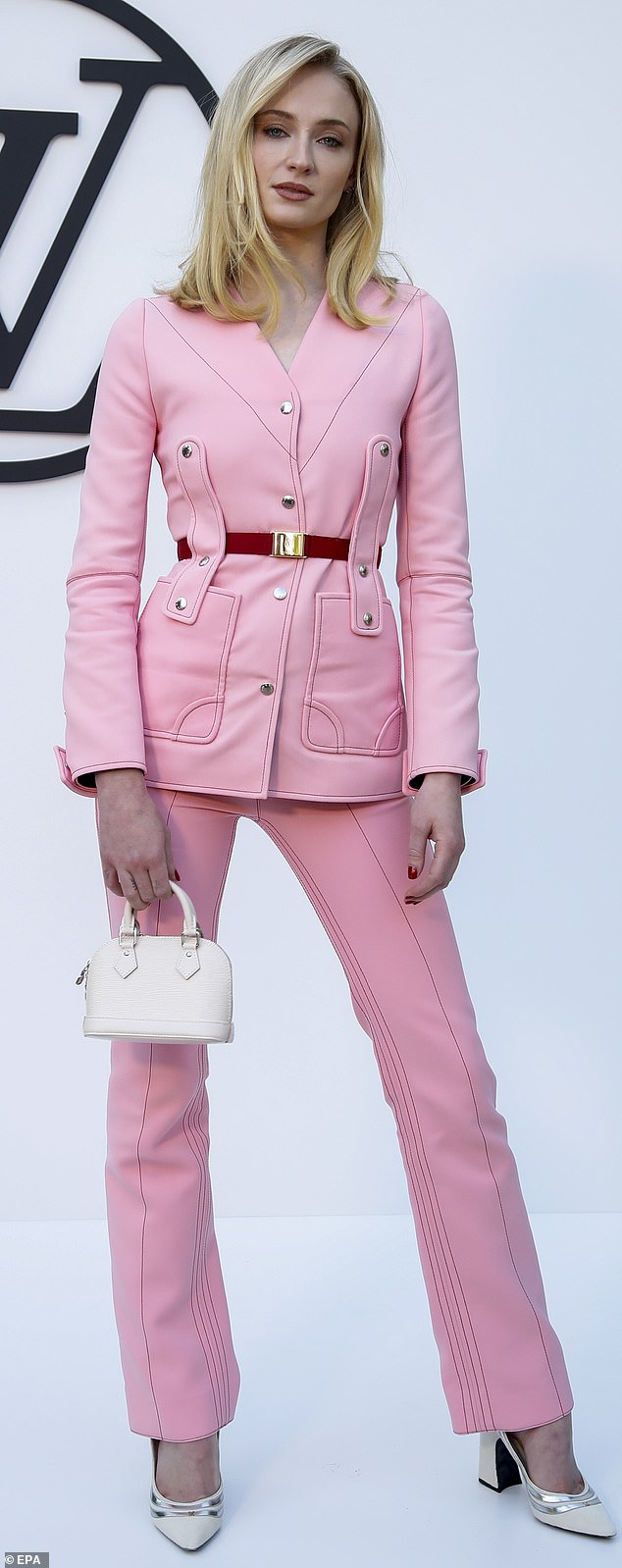 Head to toe in bubblegum pink, Sophie Turner stepped out in a Louis Vuitton trouser suit at the designer's Cruise 2025 collection in Barcelona last night