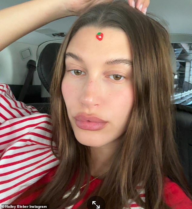 The cover girl was also seen with a red strawberry sticker on her forehead