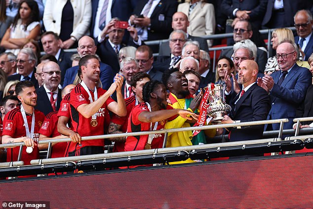 Ten Hag joined his side on the balcony for the trophy lift following what could be his final game