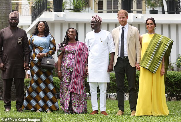 Nigeria's Chief of Defense Staff Christopher Musa (L), his wife Lilian Musa (2ndL), Lagos State Governor wife, Ibijoke Sanwo-Olu (3rdL), Lagos State Governor, Babajide Sanwo-Olu (3ndR), Britain's Prince Harry (2ndR), Duke of Sussex, and Britain's Meghan (R), Duchess of Sussex, pose for a photo at the State Governor House in Lagos on May 12