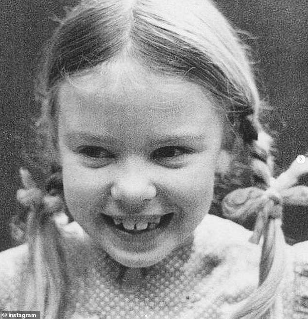 A second photo, in  black and white shows her sporting sweet pigtails and flashing her trademark smile