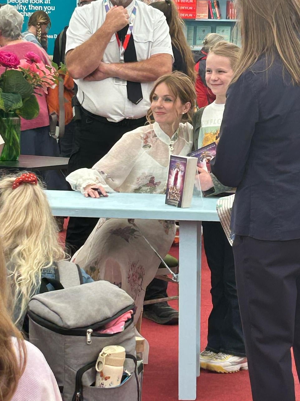 Shying away from her trademark plain white outfits, she dressed in a £695 ($884) white long-sleeved floral blouse with a matching £925 ($1,176) maxi skirt from the Australian brand, Zimmerman, she beamed as she held a signing for her new novel which features main character Rosie, the star describes as ¿a new kind of hero for today¿s young readers.¿