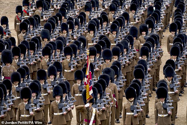 Troops of the Household Division take part in the Brigade Major's Review in London yesterday