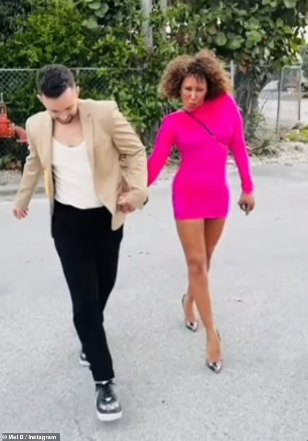 Mel B held hands with her fiancé Rory McPhee on Instagram on Friday on his birthday as she brushed off the Spice Girls' 'catty exchange' leak