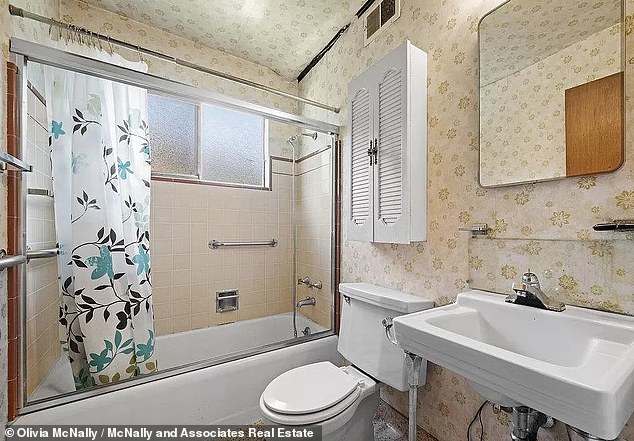 The ancient home also includes a bathroom with dim yellow wallpapering and ancient amenities