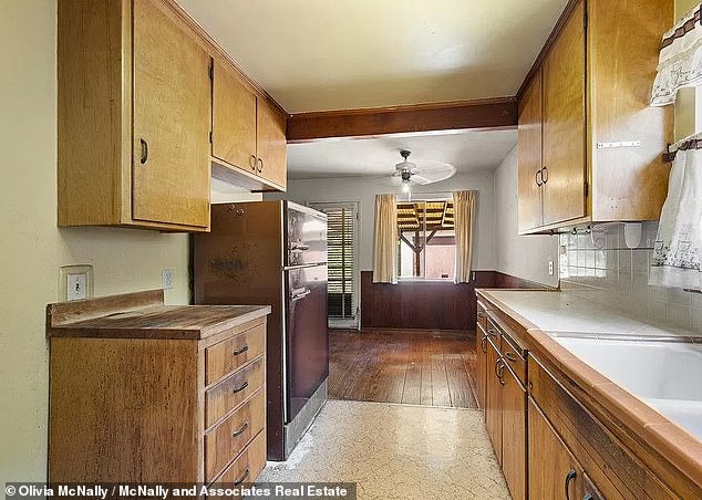 The 'fixer-upper' includes an open-plan kitchen and living room, but the new owners may want to give it a renovation