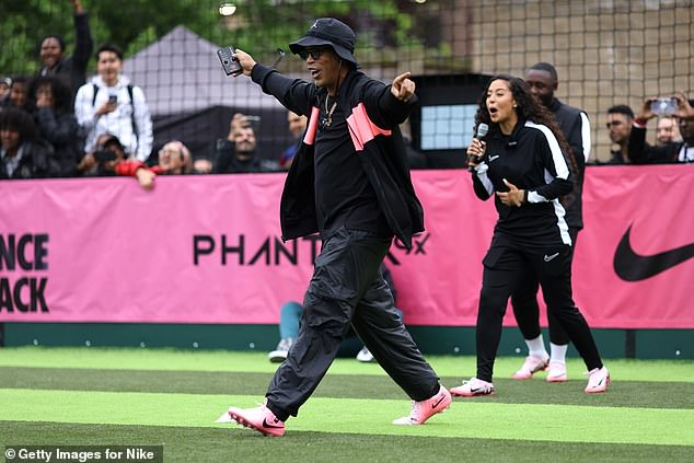 Ronaldinho raced to celebrate with a young footballer after they picked out the top corner