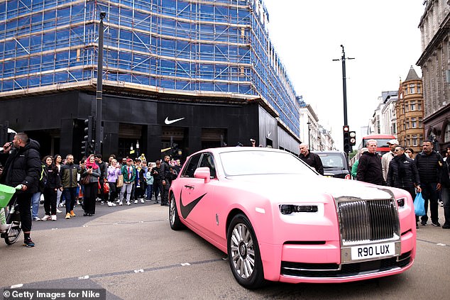 The luxury vehicle was emblazoned with the large Nike tick down both of the doors