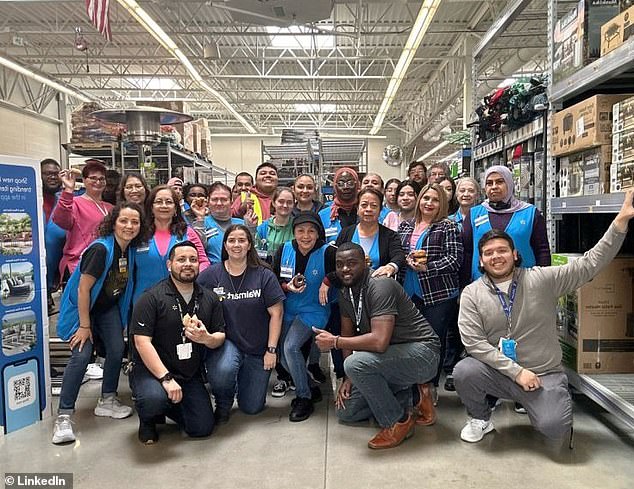 Walmart store manager Greg Harden (second from right, bottom row) and his team pose for a picture. The Dallas-area store turns more than $100million in sales annually