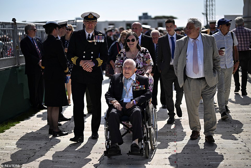 A veteran looks on as people gather to attend today's national commemorative event. Over 500 veterans gathered for the event