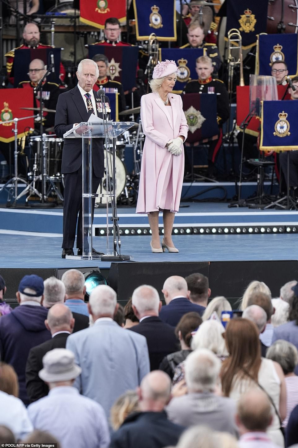 King Charles and Queen Camilla pictured on stage at the commemorative event on Southsea Common in Portsmouth this afternoon