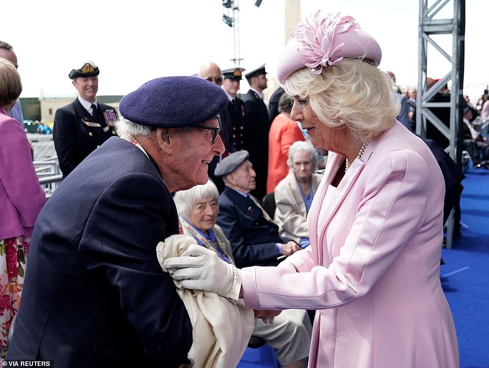 Queen Camilla - who had been visibly moved by D-Day veteran Eric Bateman's speech - pictured greeting him in Portsmouth today