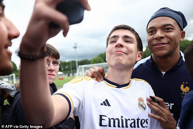 Kylian Mbappe (right) has agreed a five-year deal to join European champions Real Madrid