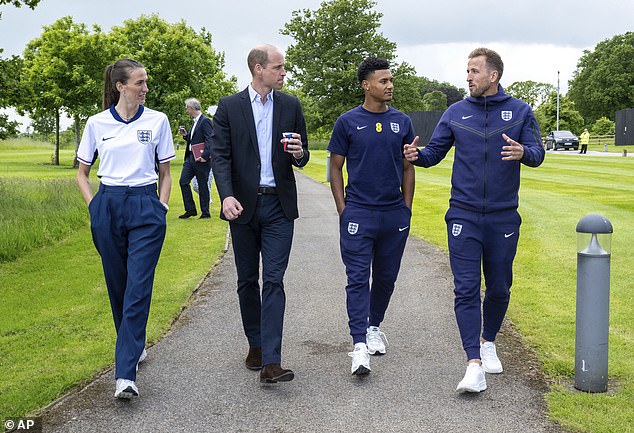 William then went for a stroll with Scott (left), Kane (right) and Ollie Watkins (second right)