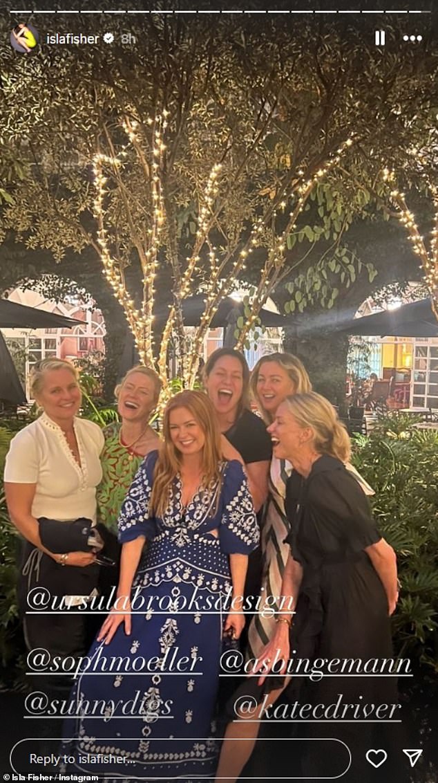 Showing off her seemingly endless supply of fashionable summer dresses, Isla also could be seen in fits of laughter with a group of female friends, including Naomi, while donning a blue lace number with side cutouts