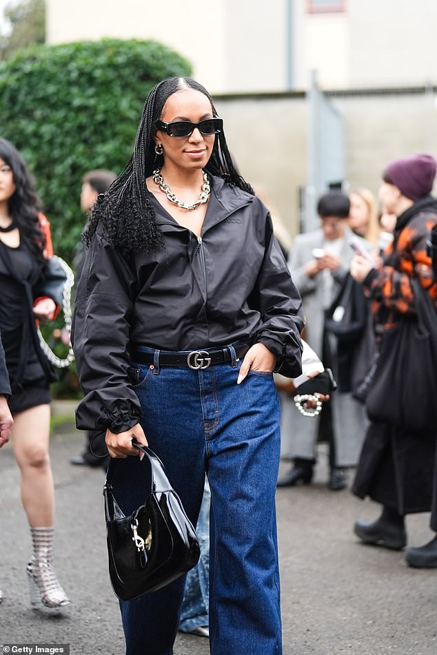 Solange Knowles, 37, was spotted in a black jacket worn as a shirt and oversize blue jeans held up with a Gucci belt