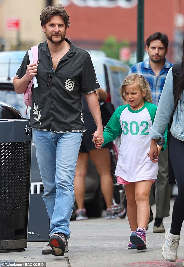 Bradley Cooper, 49, was seen taking on dad duty with his daughter Lea, seven, during an outing in New York City on Monday