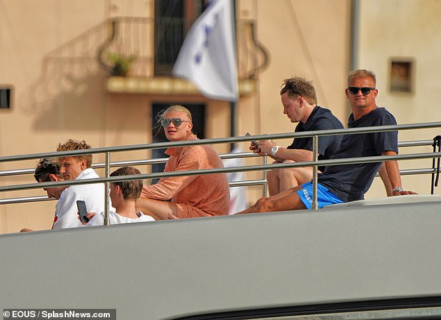 Haaland was even joined by his father Alfie (right) in the luxurious holiday location