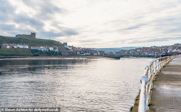 Locals in Whitby said it is 'dark and depressing' in the winter when all of the holidaymakers have gone and most of the houses lie empty. Most properties on the waterfront are holiday lets