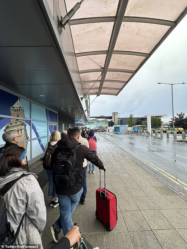 Huge queues at Birmingham Airport are continuing to cause chaos for passengers on Monday morning