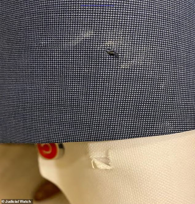 A second picture from the Secret Service files obtained by Judicial Watch shows another Commander bite mark that pierced a member's suit
