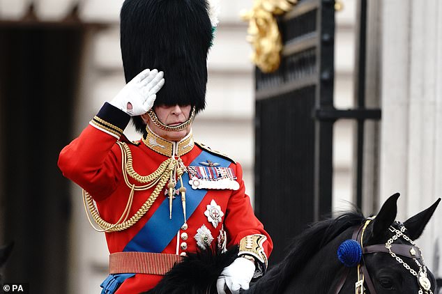 King Charles saluting as he departs Buckingham Palace for the Trooping the Colour ceremony in 2023